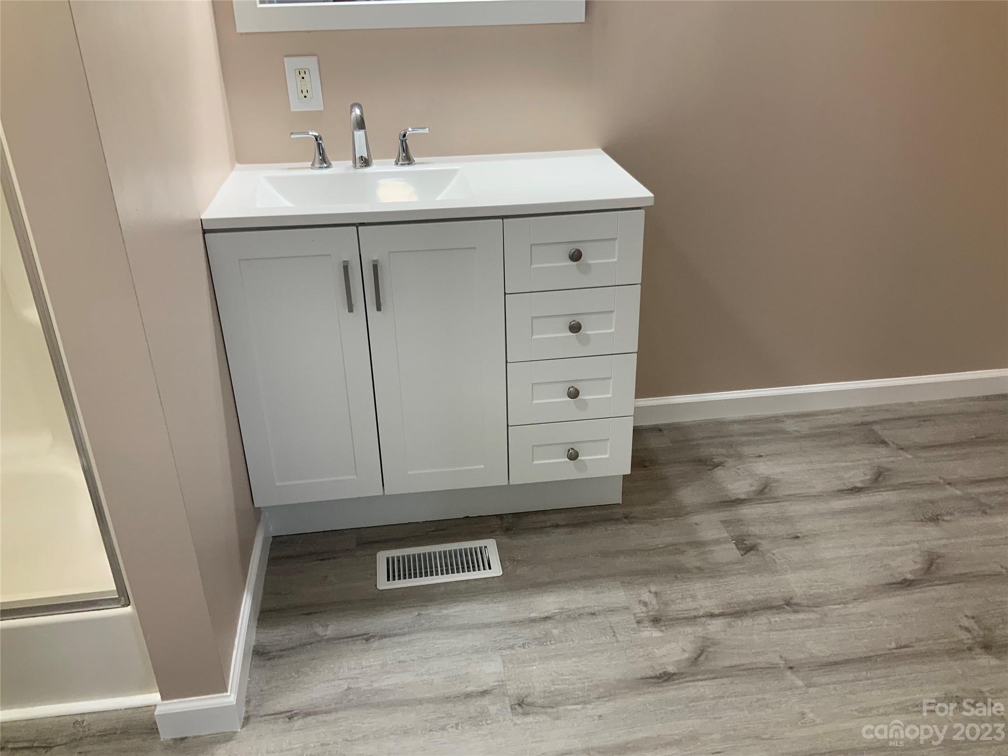 2240 Pace Road Hendersonville, NC 28792 - Photo 19 of 23 a bathroom with a sink and mirror