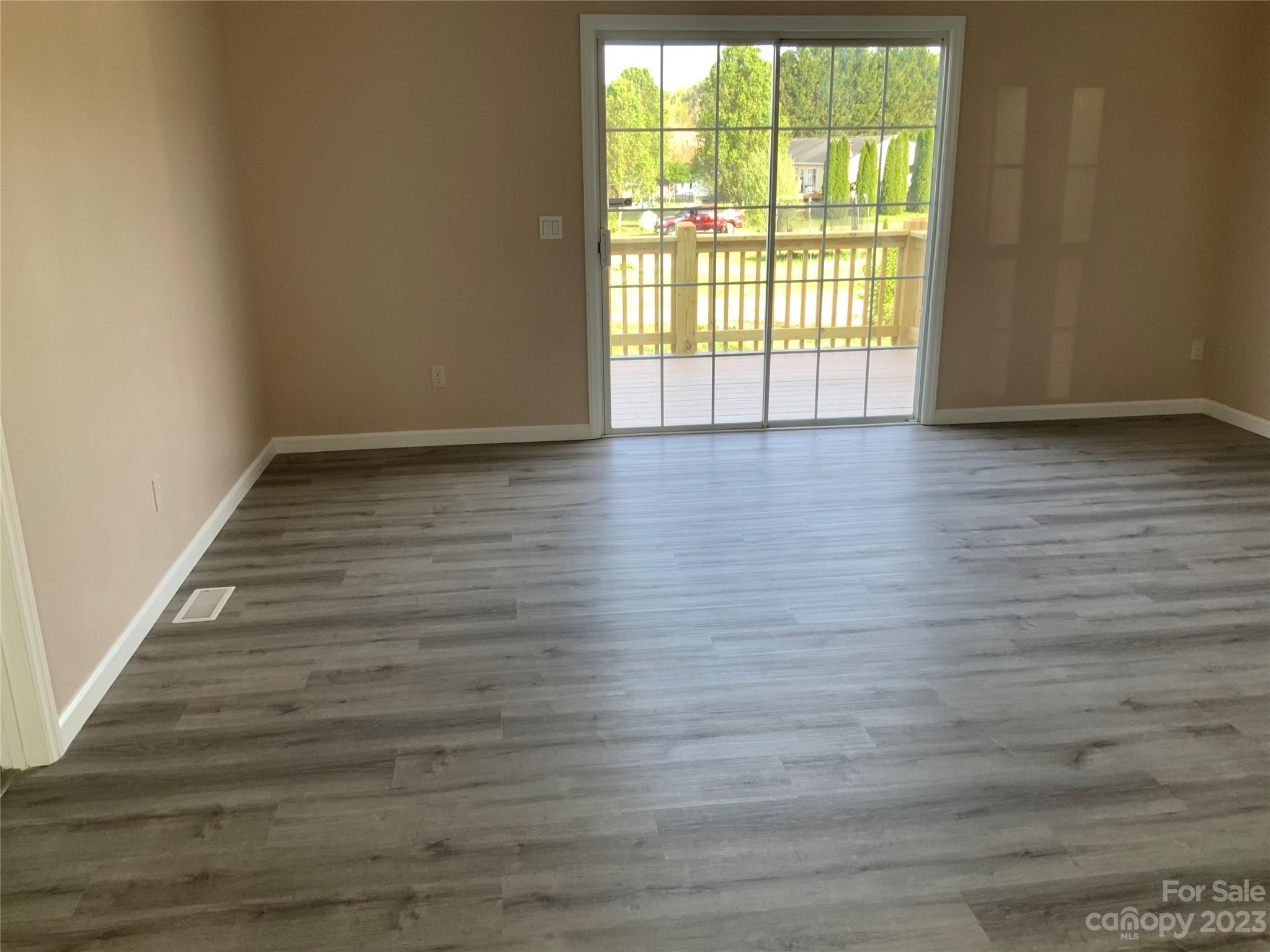 2240 Pace Road Hendersonville, NC 28792 - Photo 3 of 23 a view of wooden floor and windows in a room