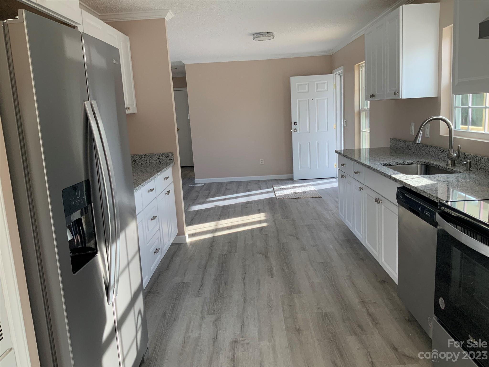 2240 Pace Road Hendersonville, NC 28792 - Photo 10 of 23 a kitchen with stainless steel appliances granite countertop a refrigerator a sink and a stove