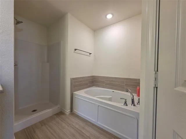 a bathroom with a sink double vanity granite and a mirror