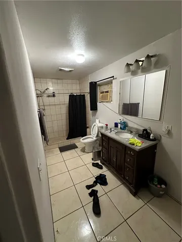 a kitchen with a refrigerator and a counter top space