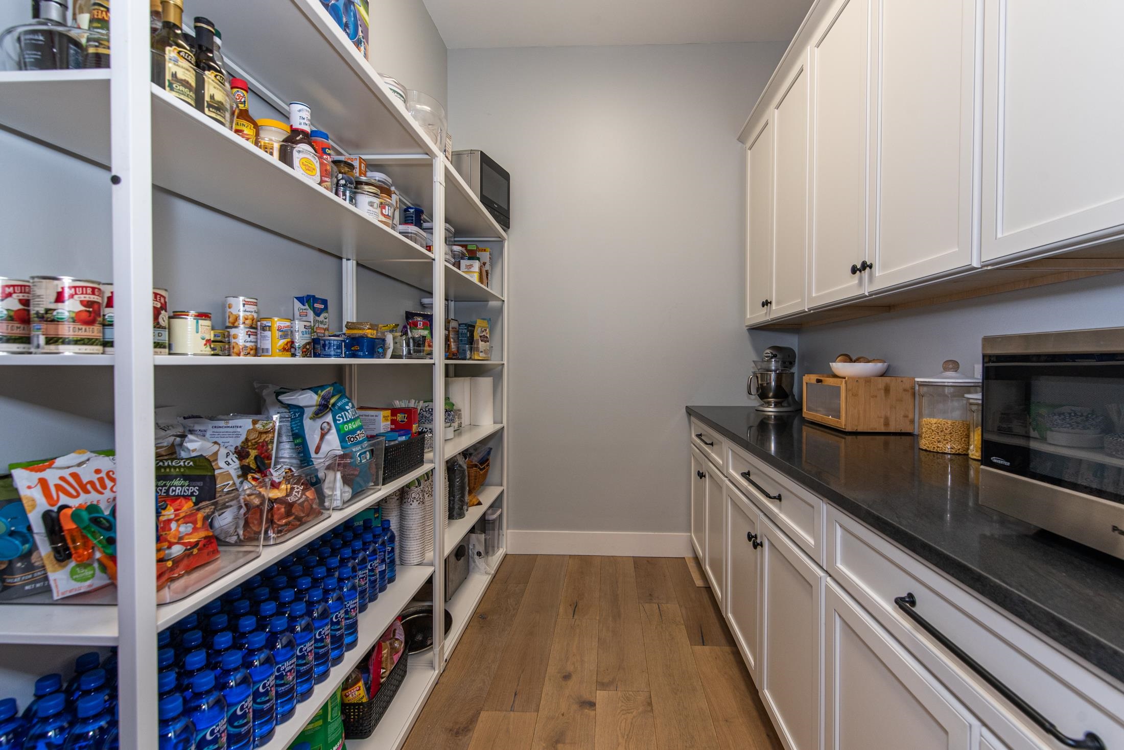 1015 Poinsettia Road St. Augustine, FL 32086 - Photo 16 of 50 a kitchen with lots of wooden floor and cabinets