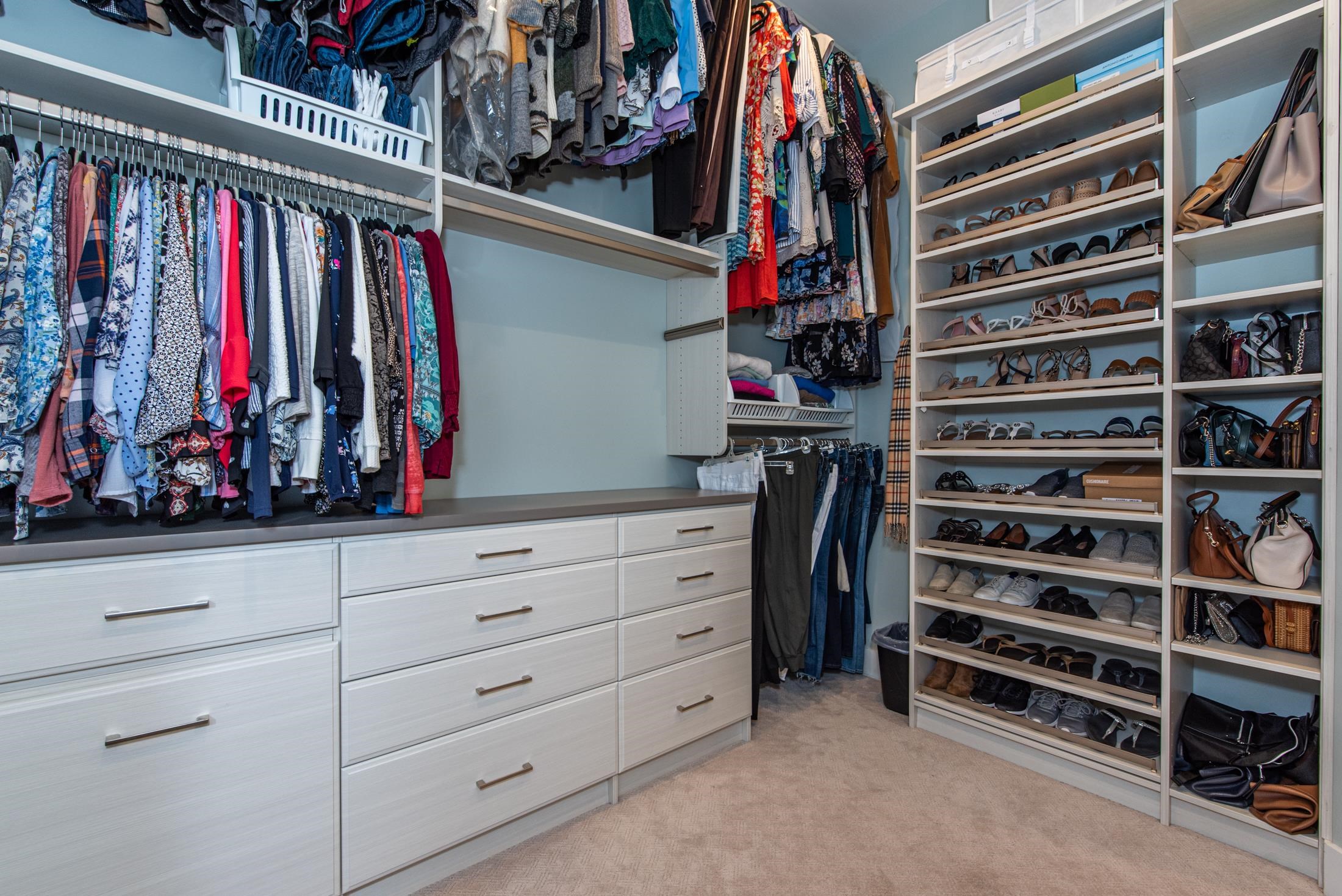 1015 Poinsettia Road St. Augustine, FL 32086 - Photo 21 of 50 a view of walk in closet with clothes and shoes