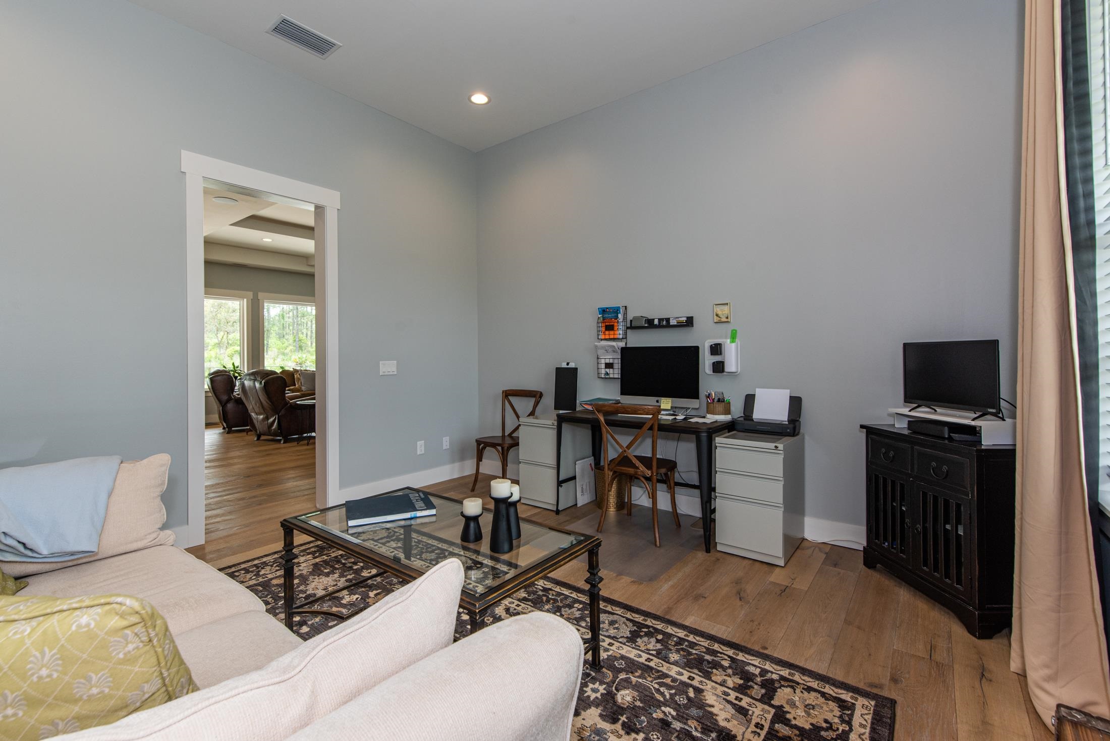 1015 Poinsettia Road St. Augustine, FL 32086 - Photo 22 of 50 a living room with furniture and a flat screen tv