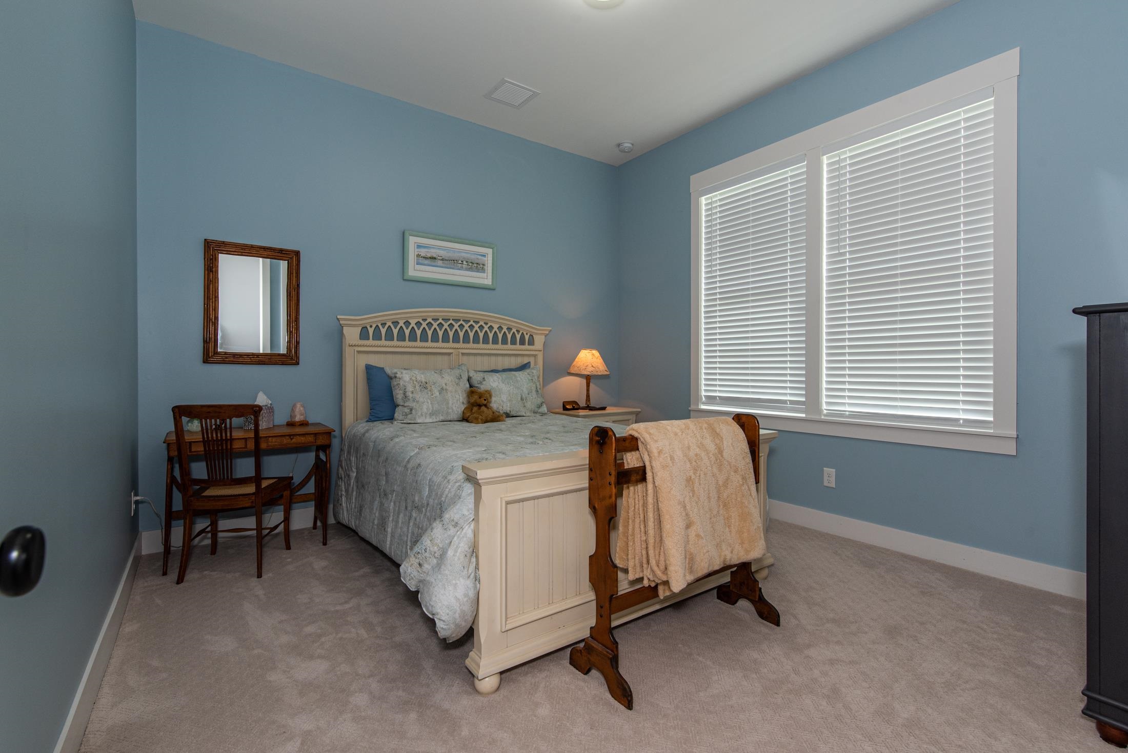 1015 Poinsettia Road St. Augustine, FL 32086 - Photo 23 of 50 a bedroom with a bed chair and window