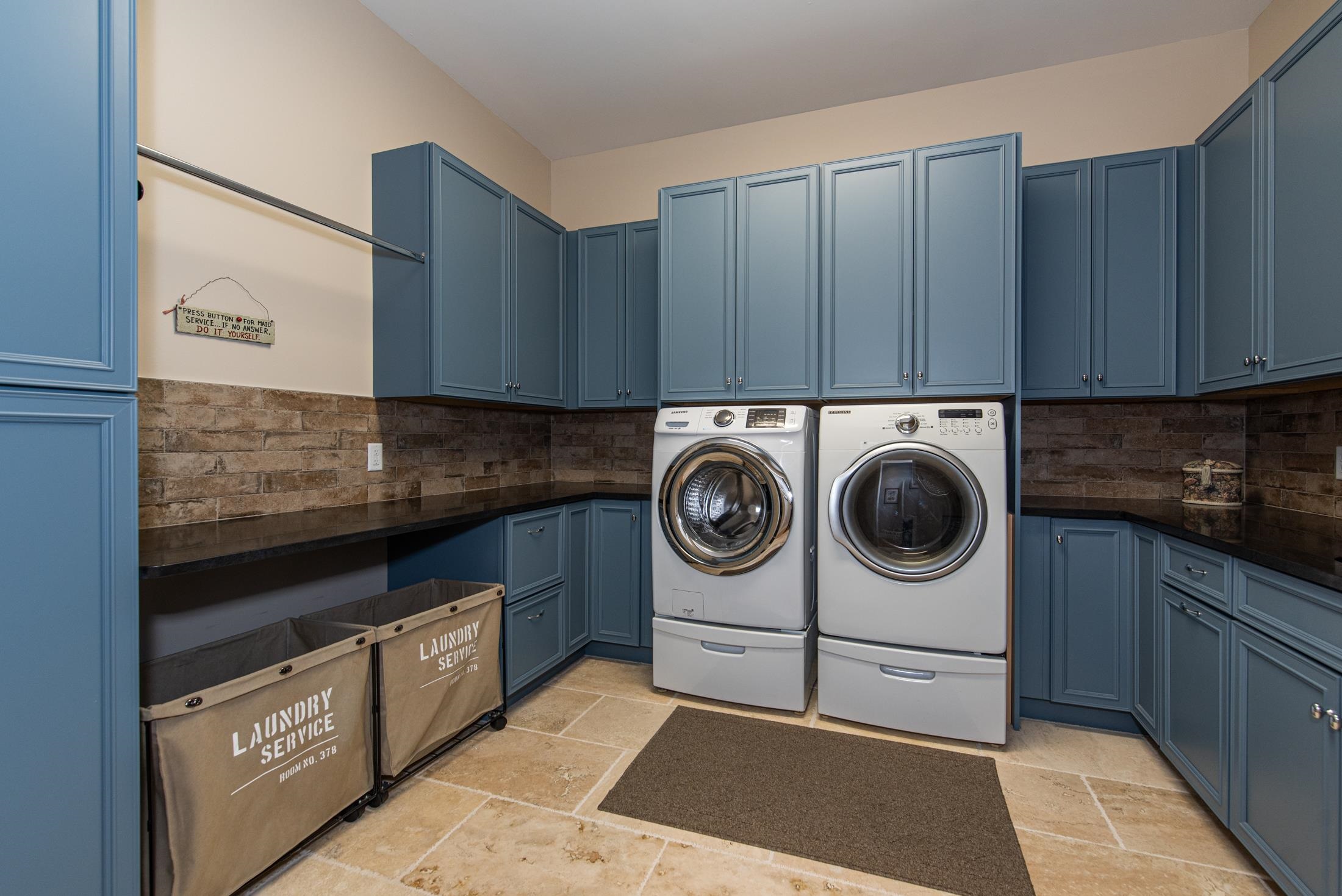 1015 Poinsettia Road St. Augustine, FL 32086 - Photo 25 of 50 a utility room with sink dryer and washer