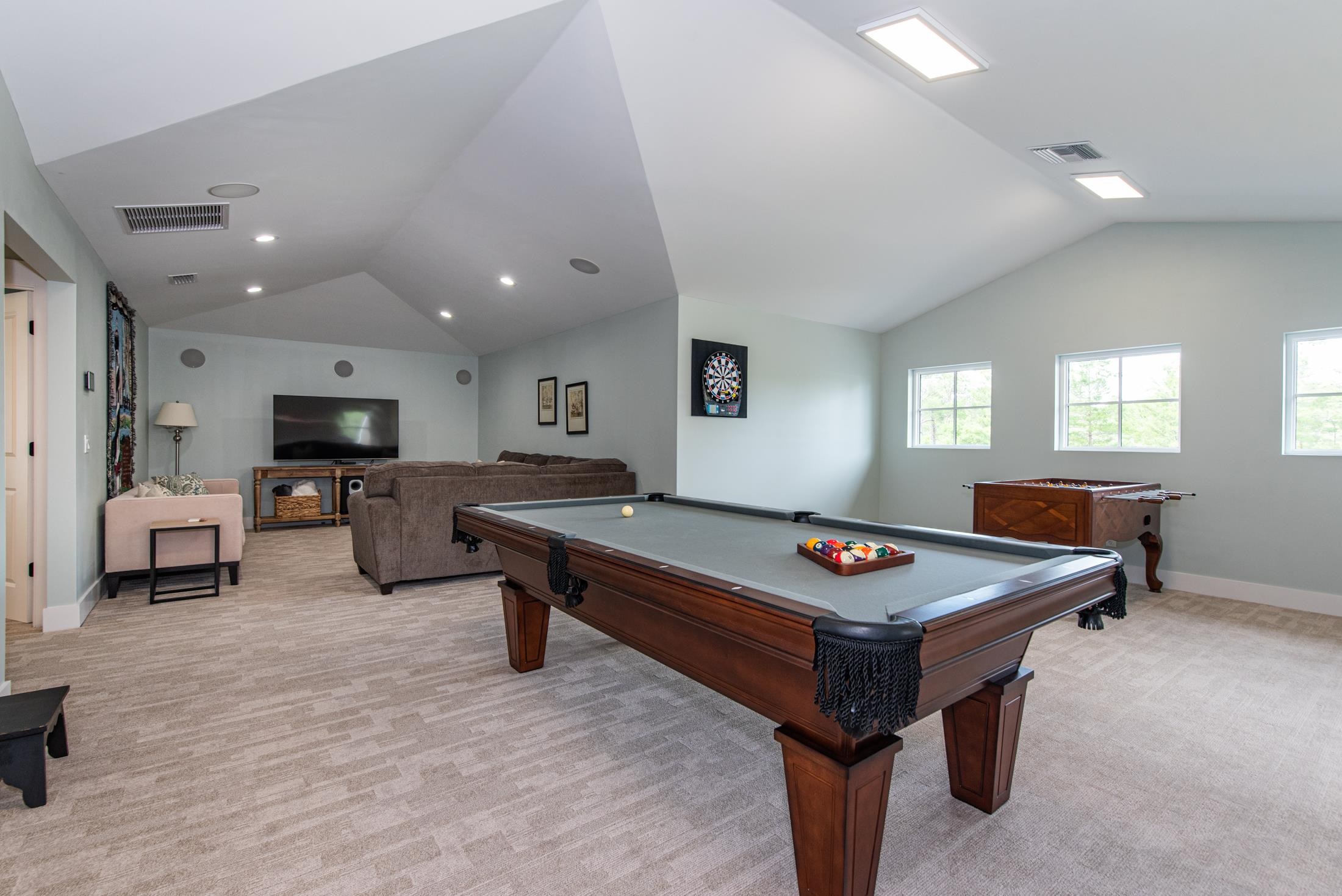 1015 Poinsettia Road St. Augustine, FL 32086 - Photo 27 of 50 a living room with furniture pool table and flat screen tv