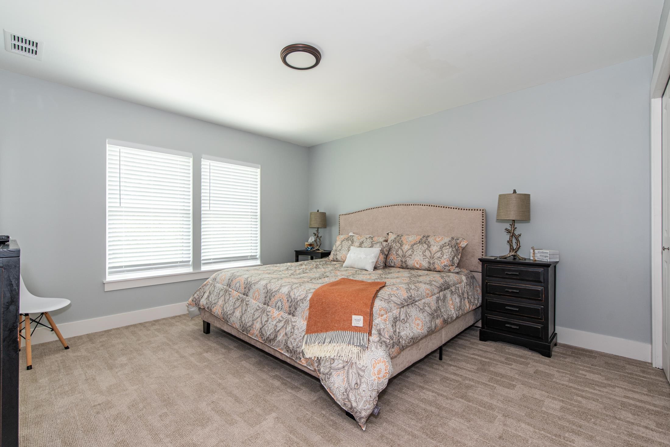 1015 Poinsettia Road St. Augustine, FL 32086 - Photo 28 of 50 a large bed sitting in a bedroom next to a window