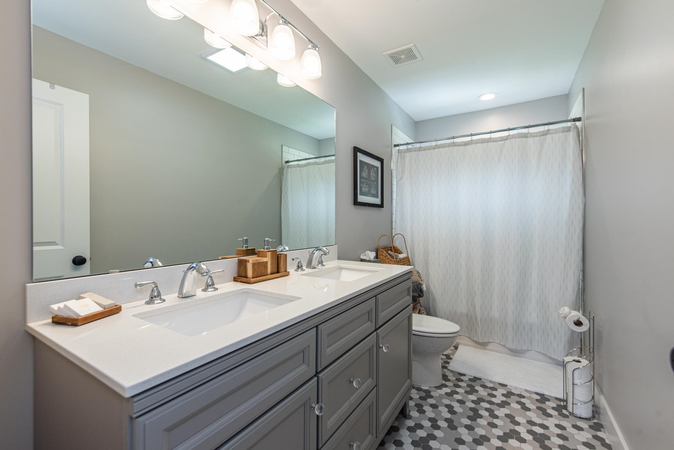 1015 Poinsettia Road St. Augustine, FL 32086 - Photo 30 of 50 a bathroom with a sink a toilet a mirror and shower