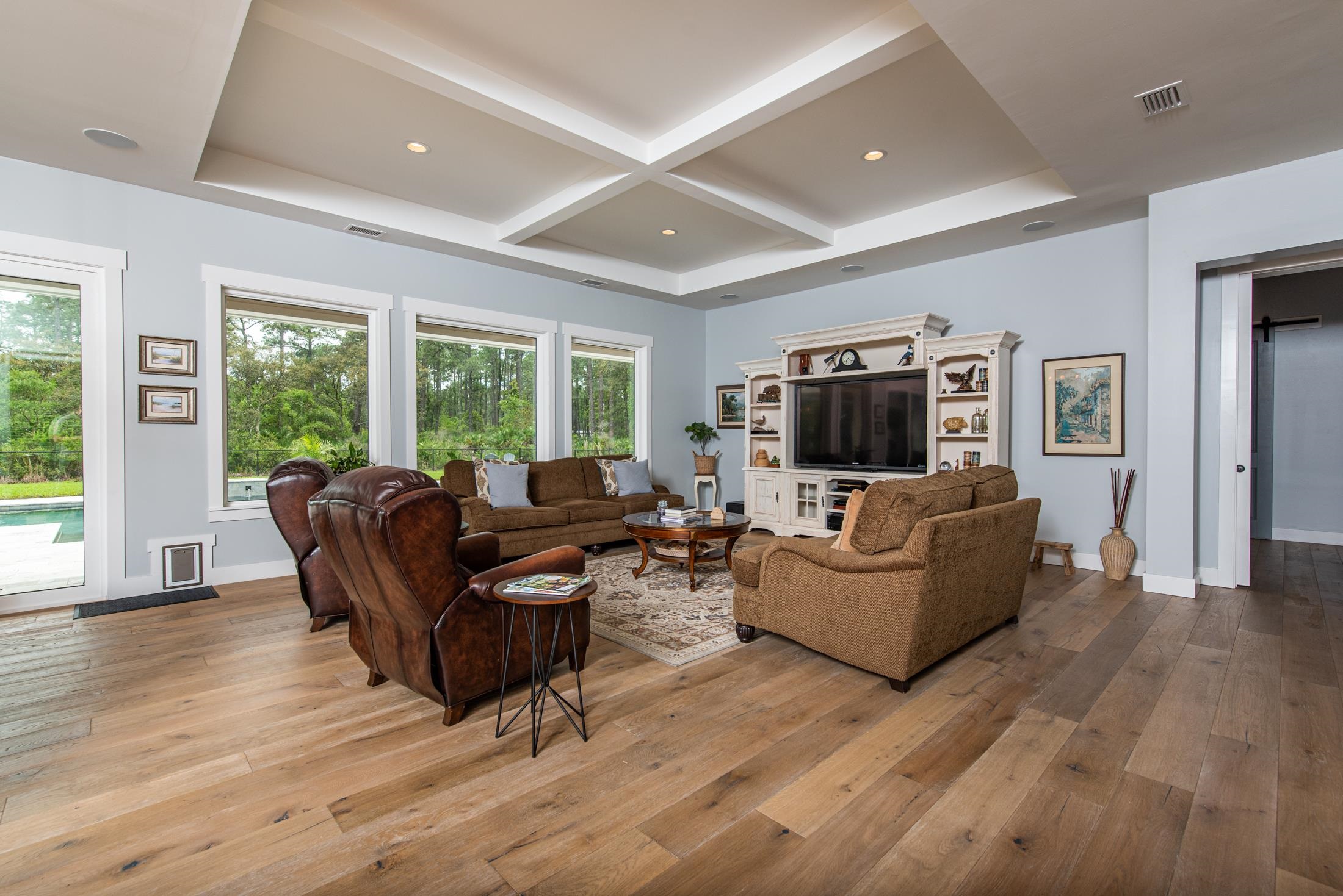 1015 Poinsettia Road St. Augustine, FL 32086 - Photo 3 of 50 a living room with furniture and a flat screen tv