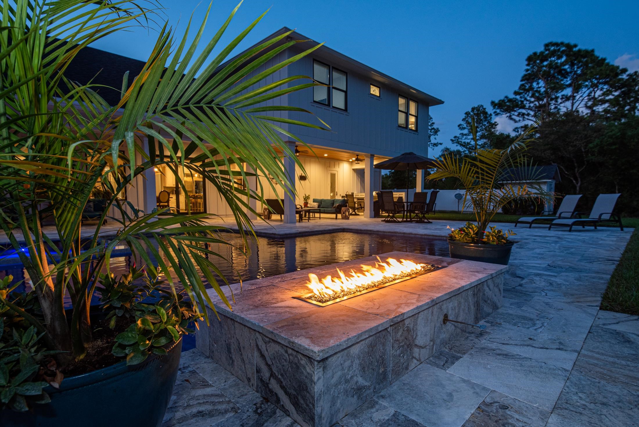 1015 Poinsettia Road St. Augustine, FL 32086 - Photo 32 of 50 a view of a chairs and table in the patio