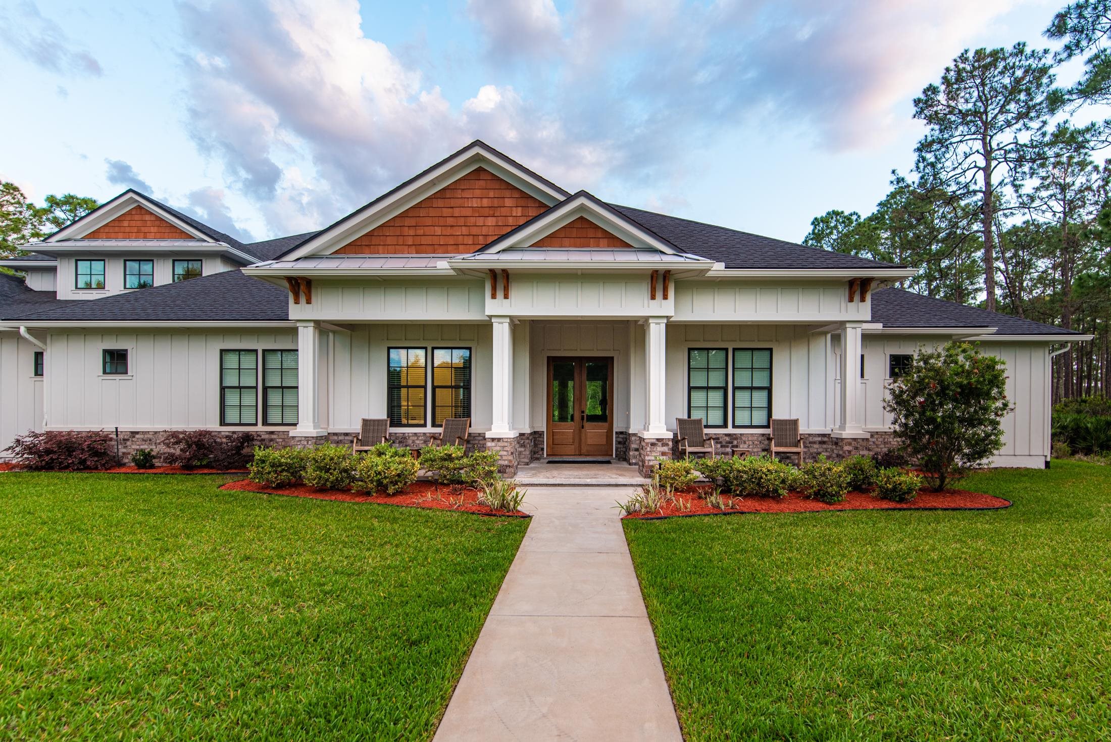 1015 Poinsettia Road St. Augustine, FL 32086 - Photo 33 of 50 a front view of a house with a yard and porch