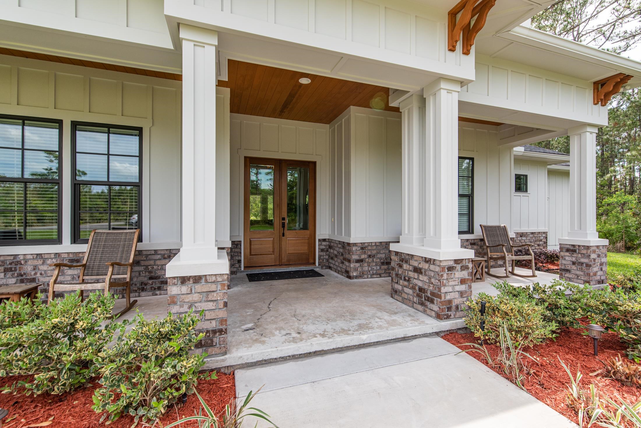 1015 Poinsettia Road St. Augustine, FL 32086 - Photo 35 of 50 a front view of house with outdoor seating