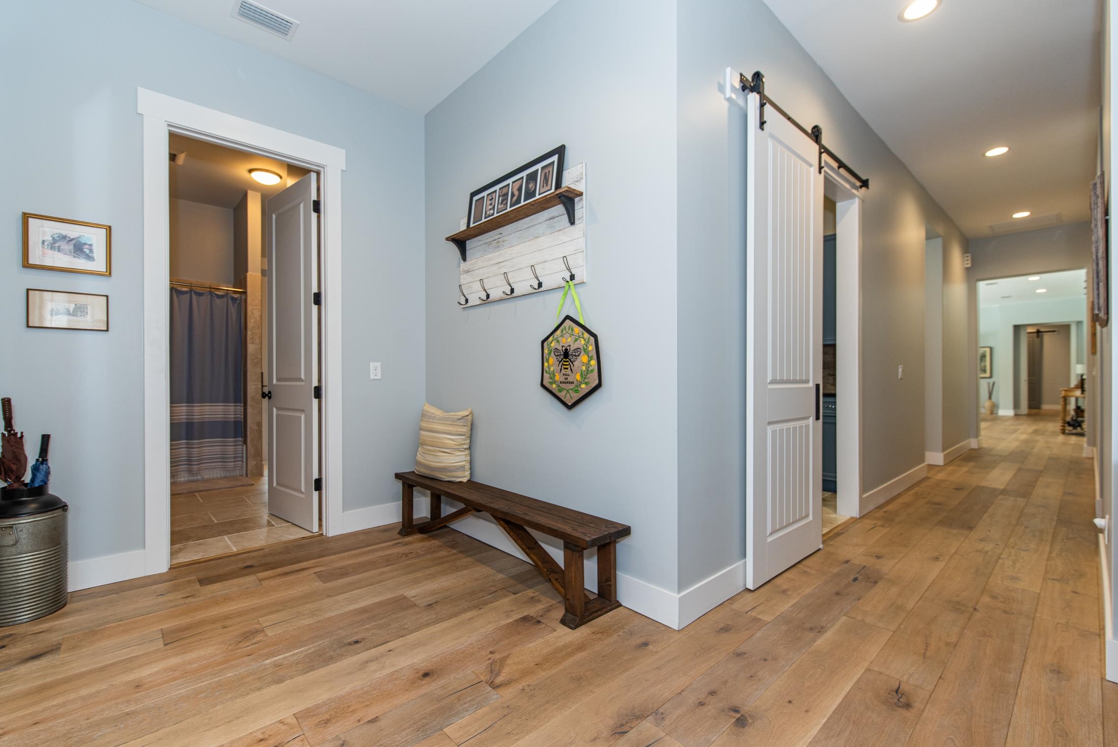 1015 Poinsettia Road St. Augustine, FL 32086 - Photo 40 of 50 a view of a hallway with wooden floor and door