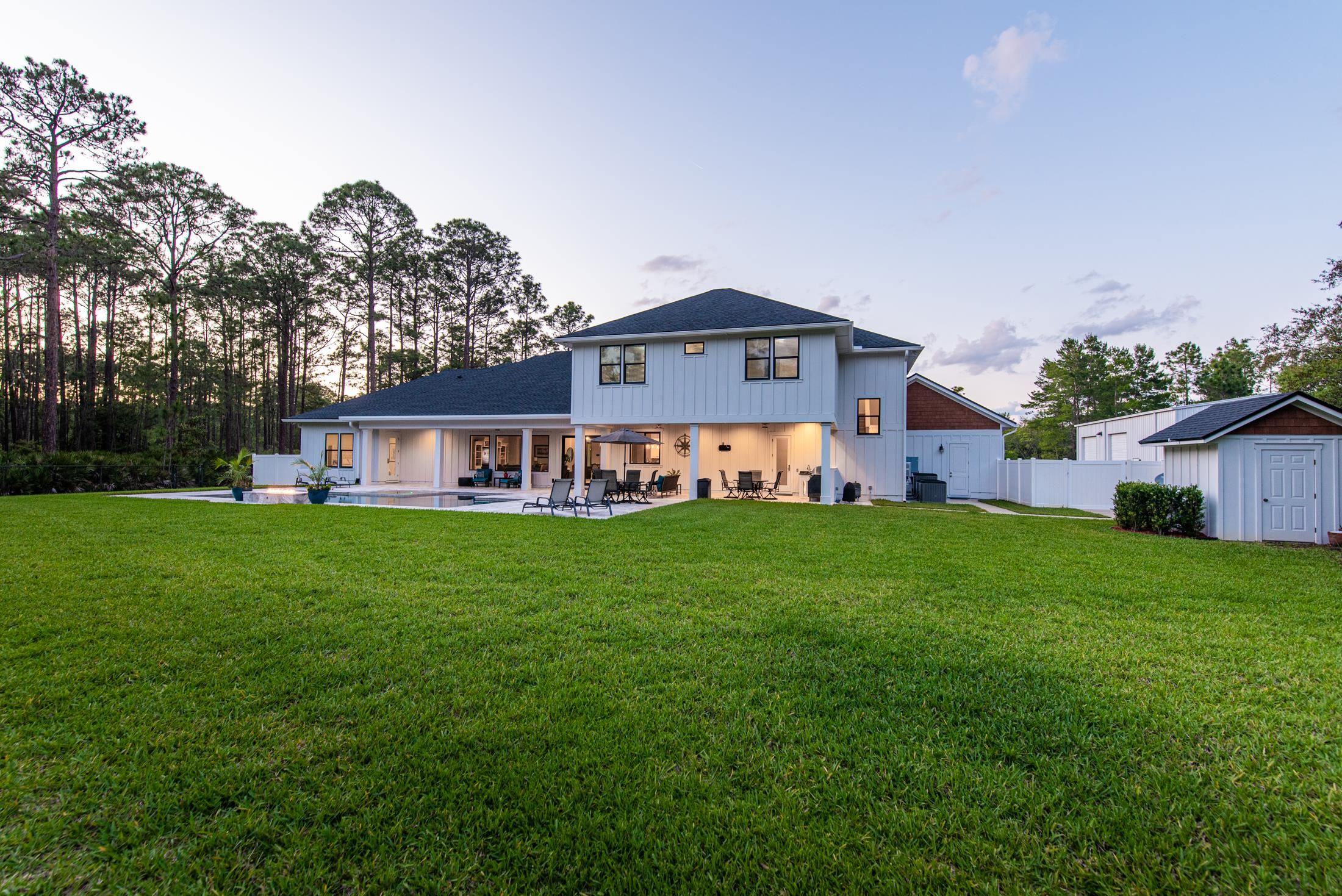 1015 Poinsettia Road St. Augustine, FL 32086 - Photo 41 of 50 a front view of a house with garden