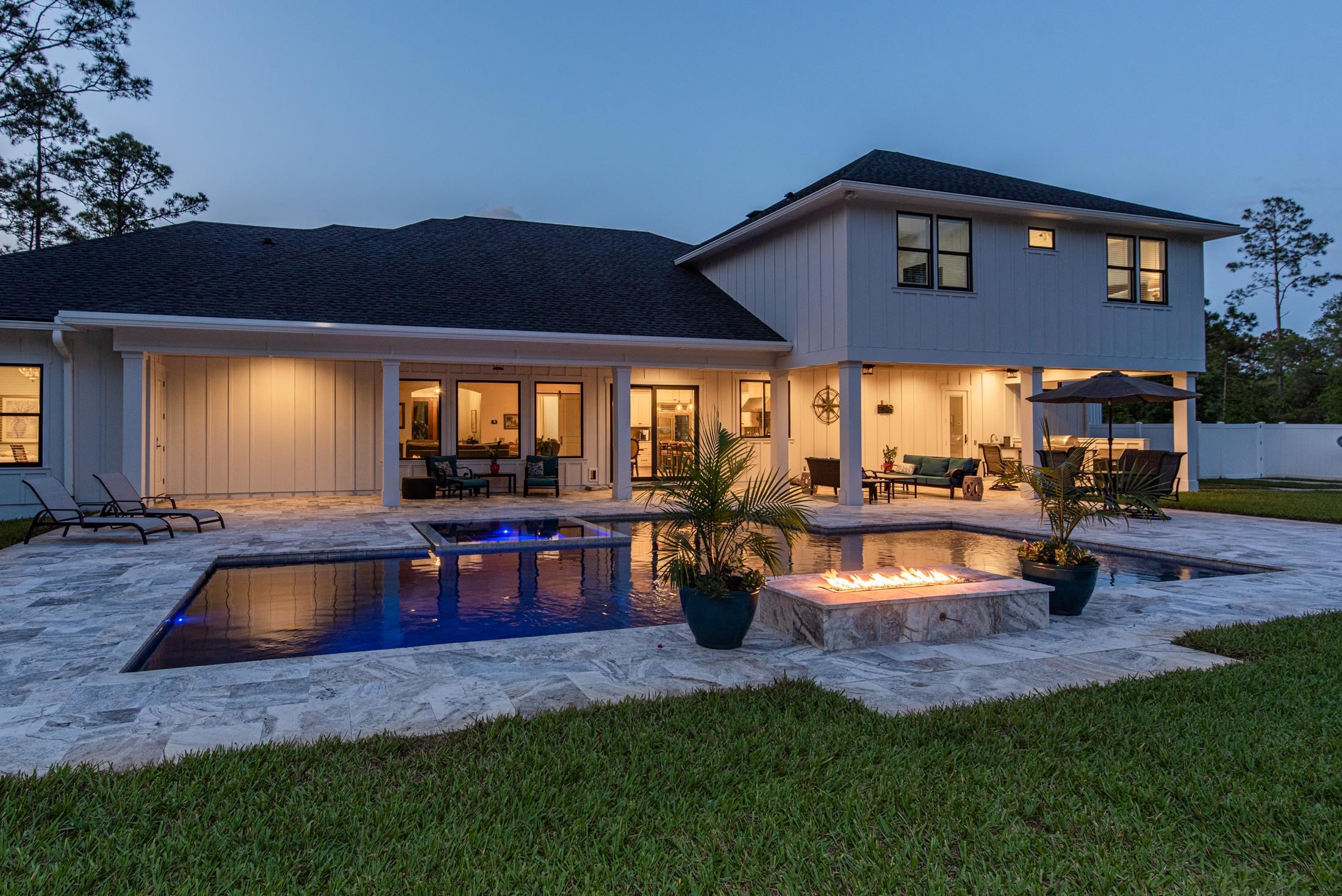 1015 Poinsettia Road St. Augustine, FL 32086 - Photo 42 of 50 a view of a house with pool and a yard