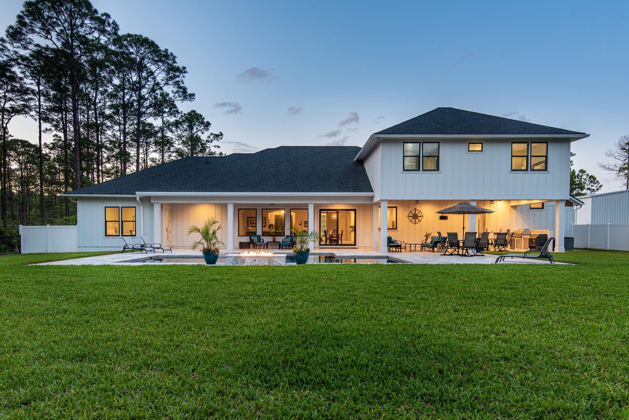 1015 Poinsettia Road St. Augustine, FL 32086 - Photo 44 of 50 a front view of a house with a garden