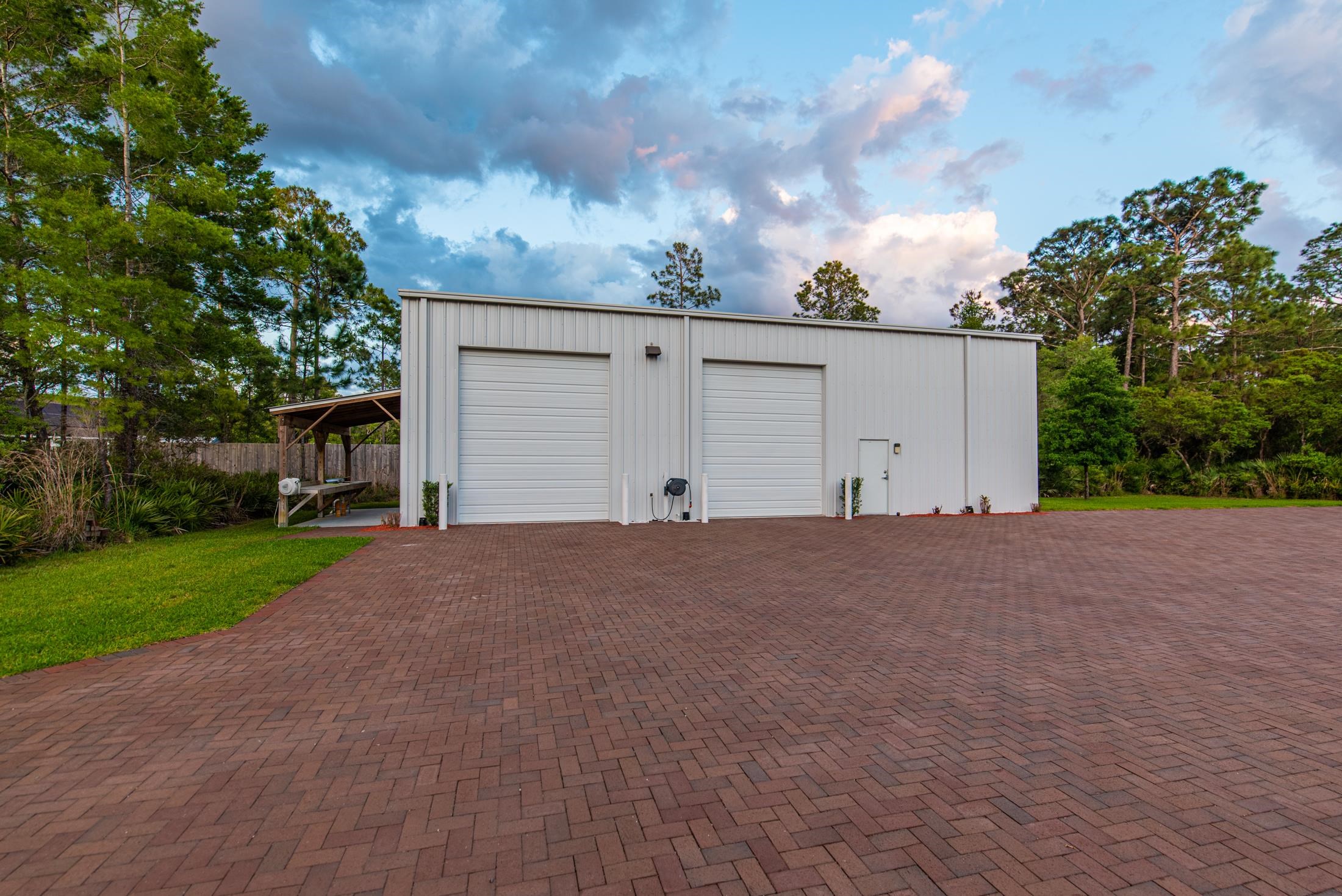 1015 Poinsettia Road St. Augustine, FL 32086 - Photo 47 of 50 a view of garage and yard