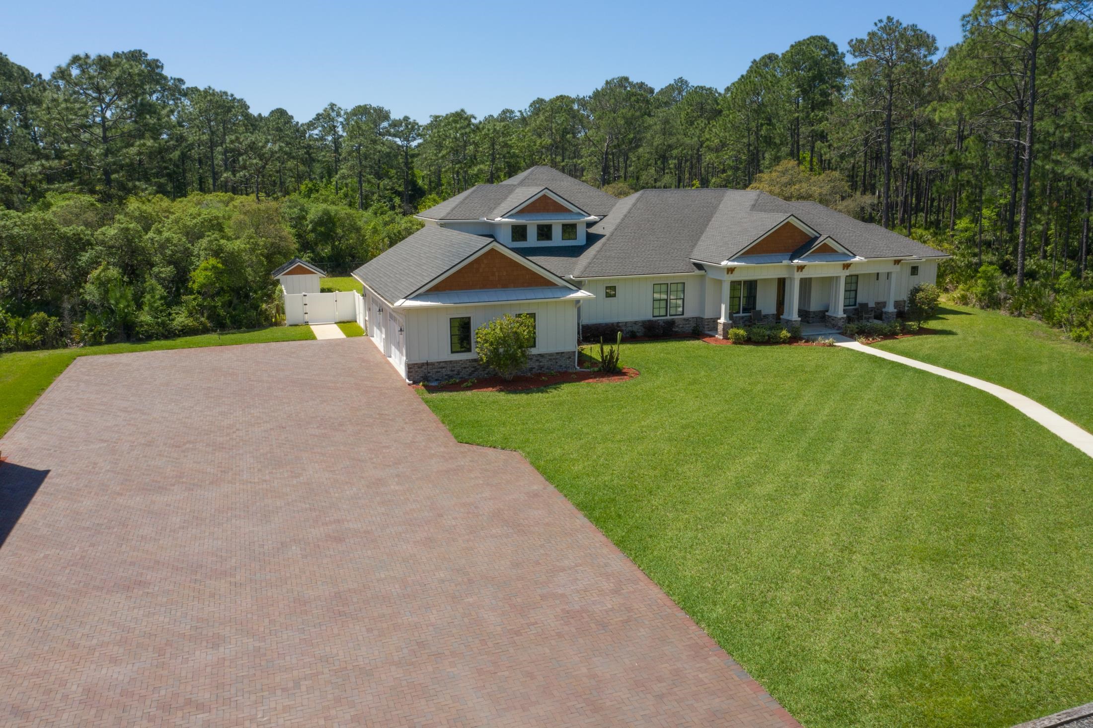 1015 Poinsettia Road St. Augustine, FL 32086 - Photo 5 of 50 a front view of a house with yard