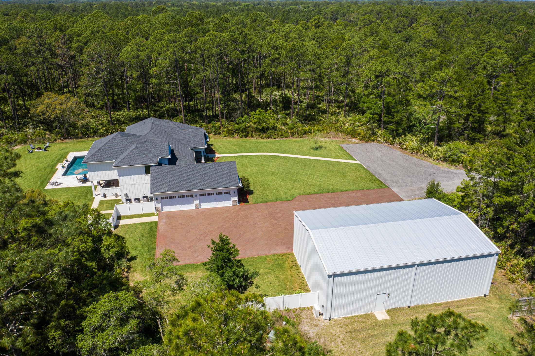 1015 Poinsettia Road St. Augustine, FL 32086 - Photo 6 of 50 an aerial view of a house