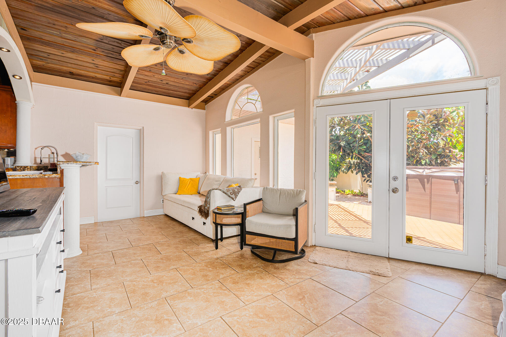 46 Oceanview Avenue Ponce Inlet, FL 32127 - Photo 12 of 79 a living room with furniture a flat screen tv and a window