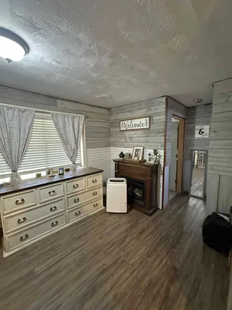 a view of room with furniture and window