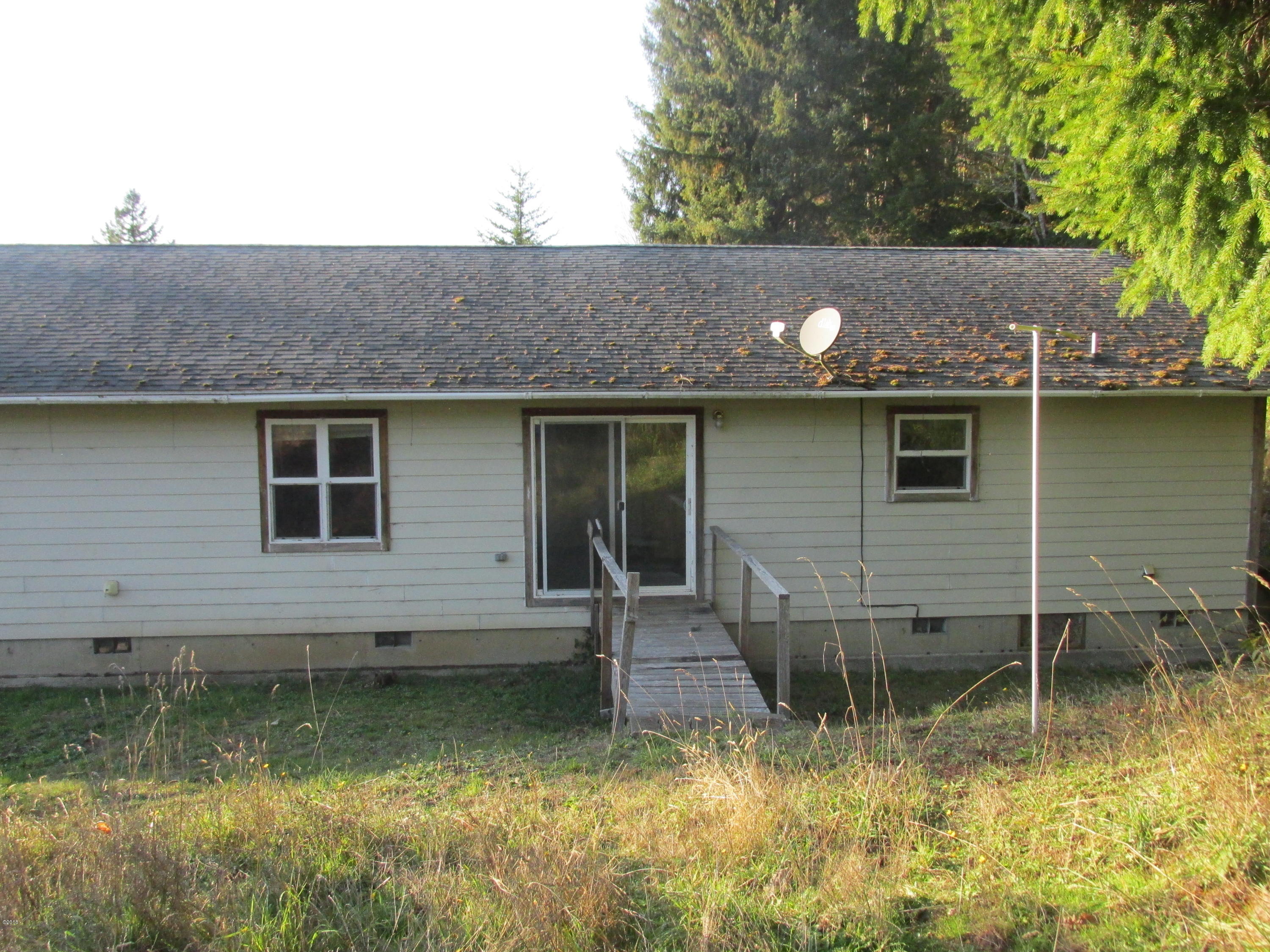 516 Elk City Road Toledo, OR 97391 - Photo 2 of 15 Rear