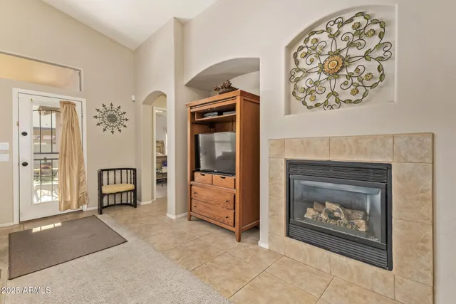 a living room with furniture and a fireplace