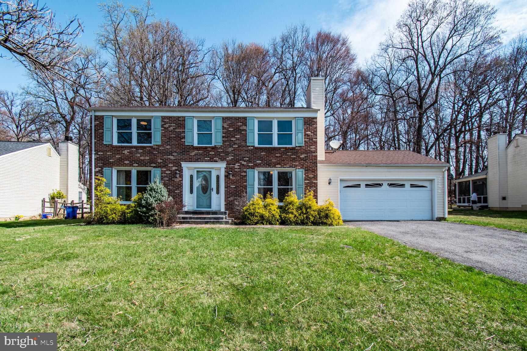 a view of house with yard