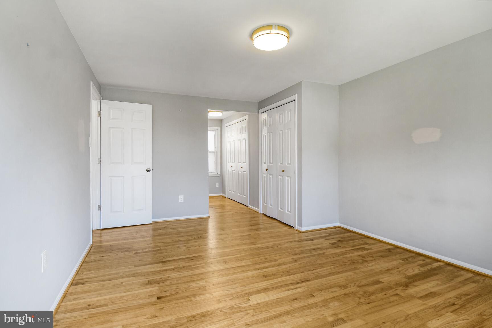 15320 Baileys Lane Silver Spring, MD 20906 - Photo 12 of 28 a view of an empty room and wooden floor