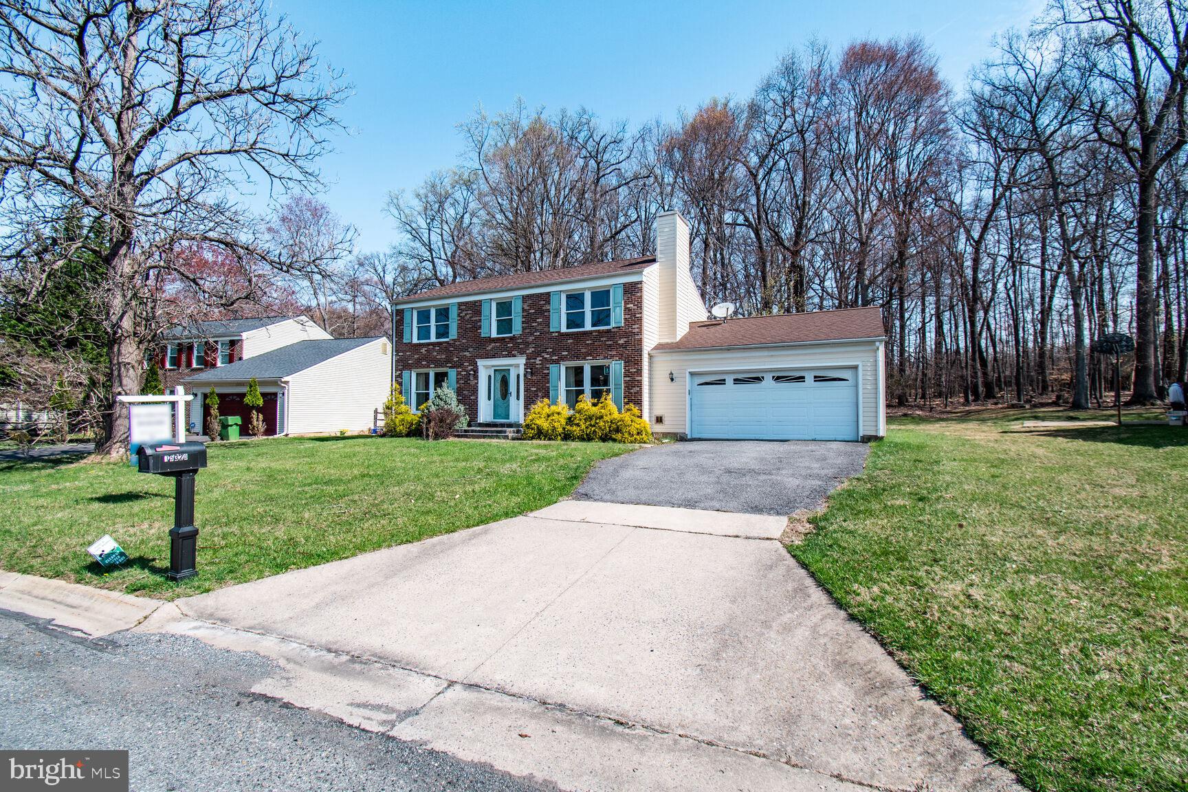 15320 Baileys Lane Silver Spring, MD 20906 - Photo 2 of 28 front view of a house with a yard and an trees