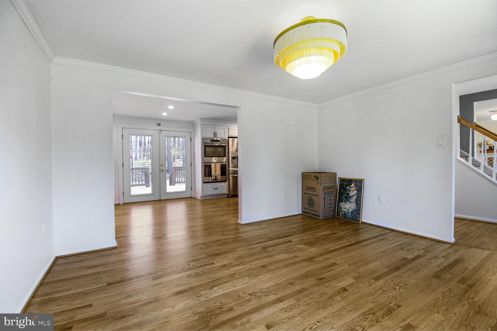 15320 Baileys Lane Silver Spring, MD 20906 - Photo 4 of 28 a view of an empty room with wooden floor and a window