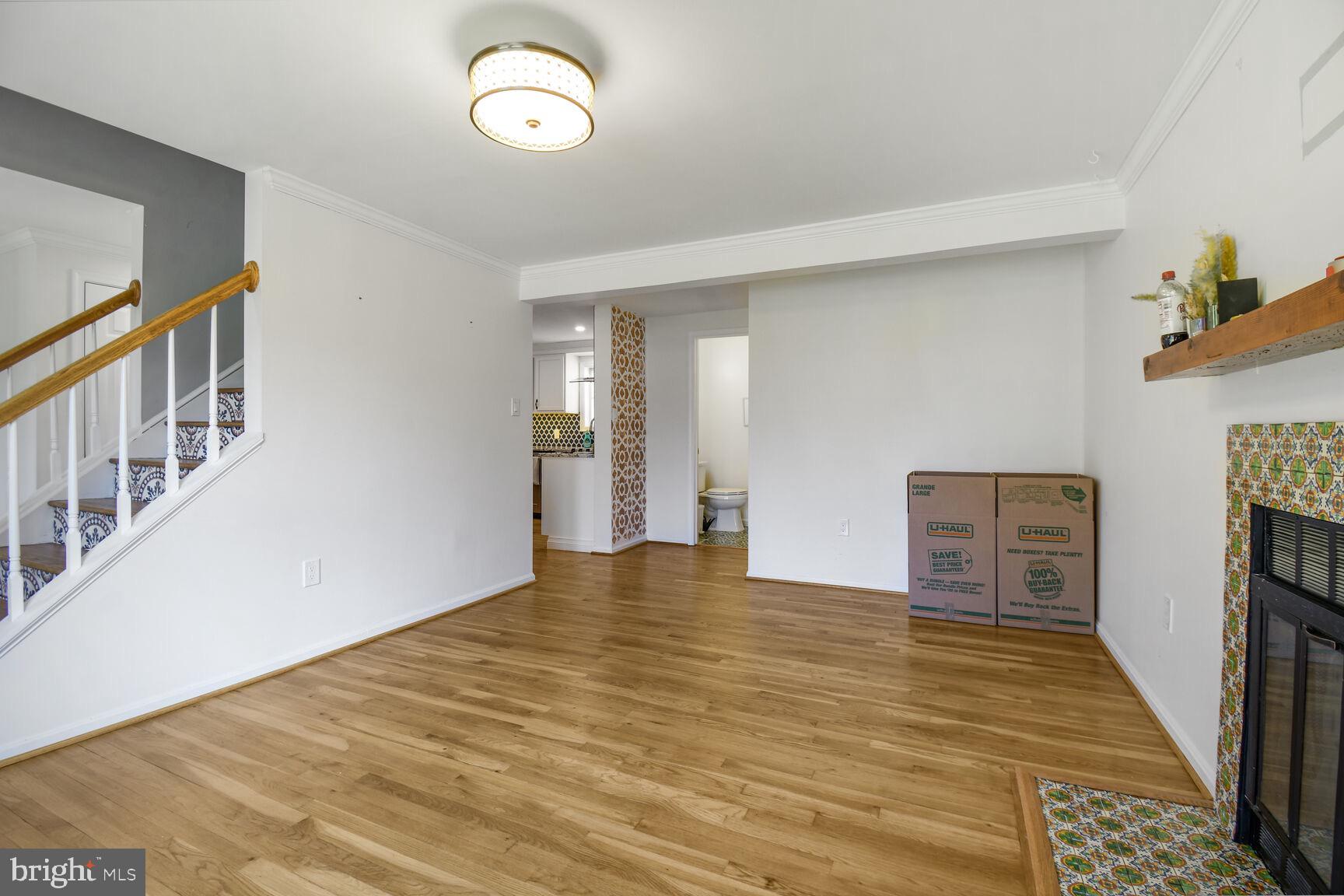 15320 Baileys Lane Silver Spring, MD 20906 - Photo 6 of 28 a view of an empty room with window and hardwood floor