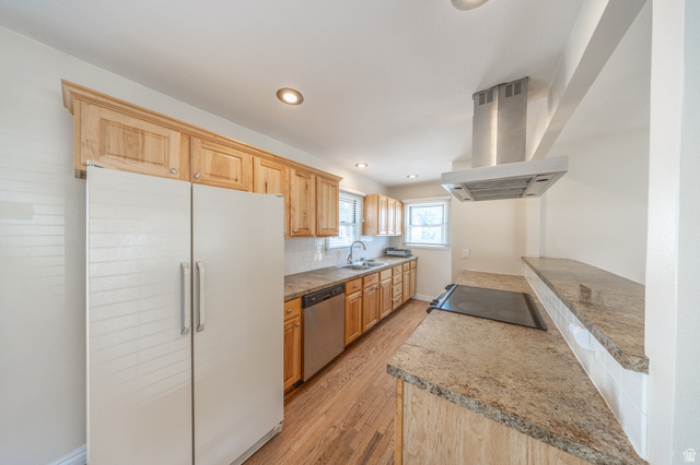 193 Locust Street Clearfield, UT 84015 - Photo 10 of 29 Kitchen featuring wood cabinetry, a stainless steel range hood, stone countertops, and wood-finish flooring