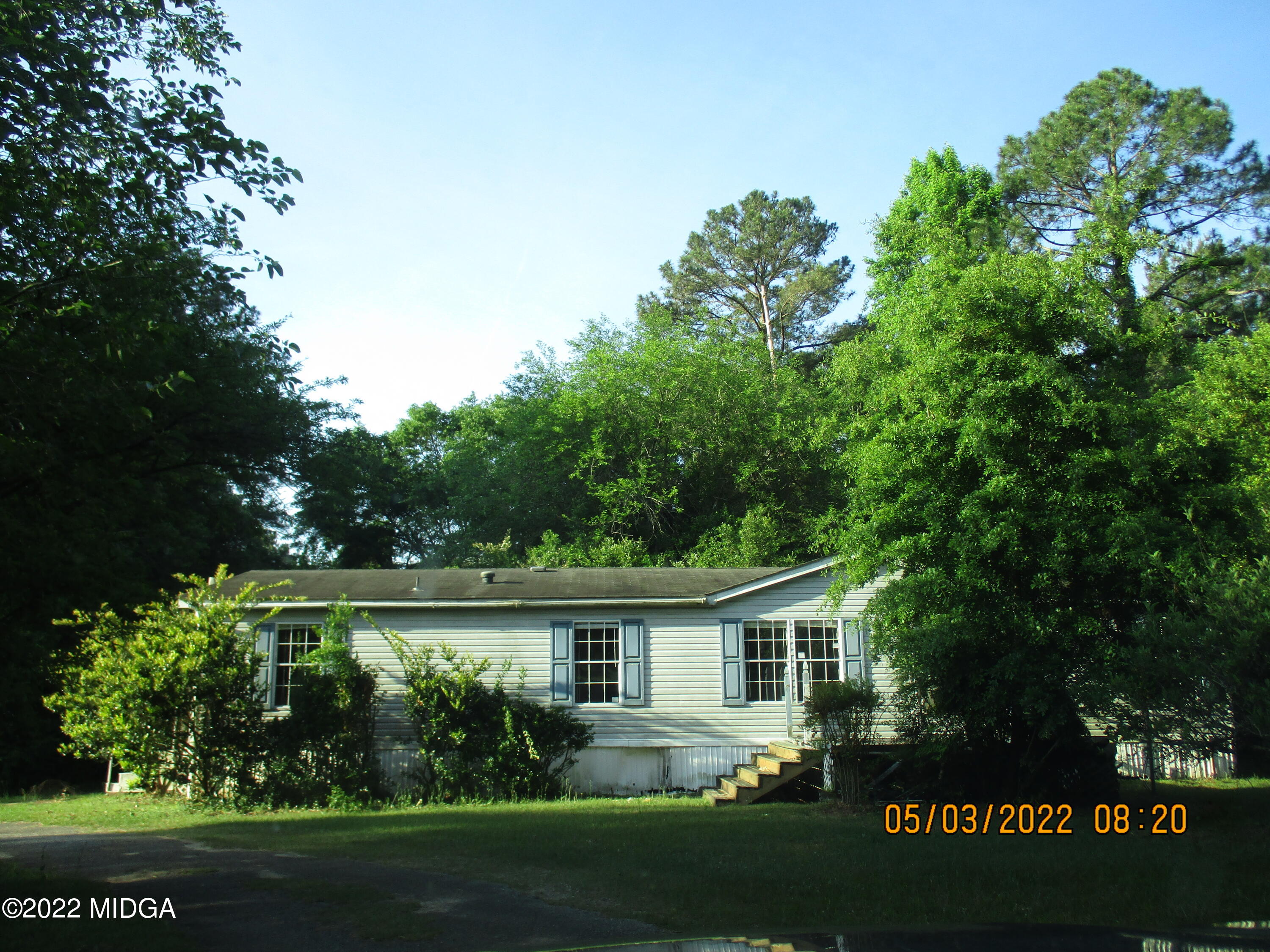 576 Hendrick Road Fort Valley, GA 31030 - Photo 1 of 19 front view of house with a garden