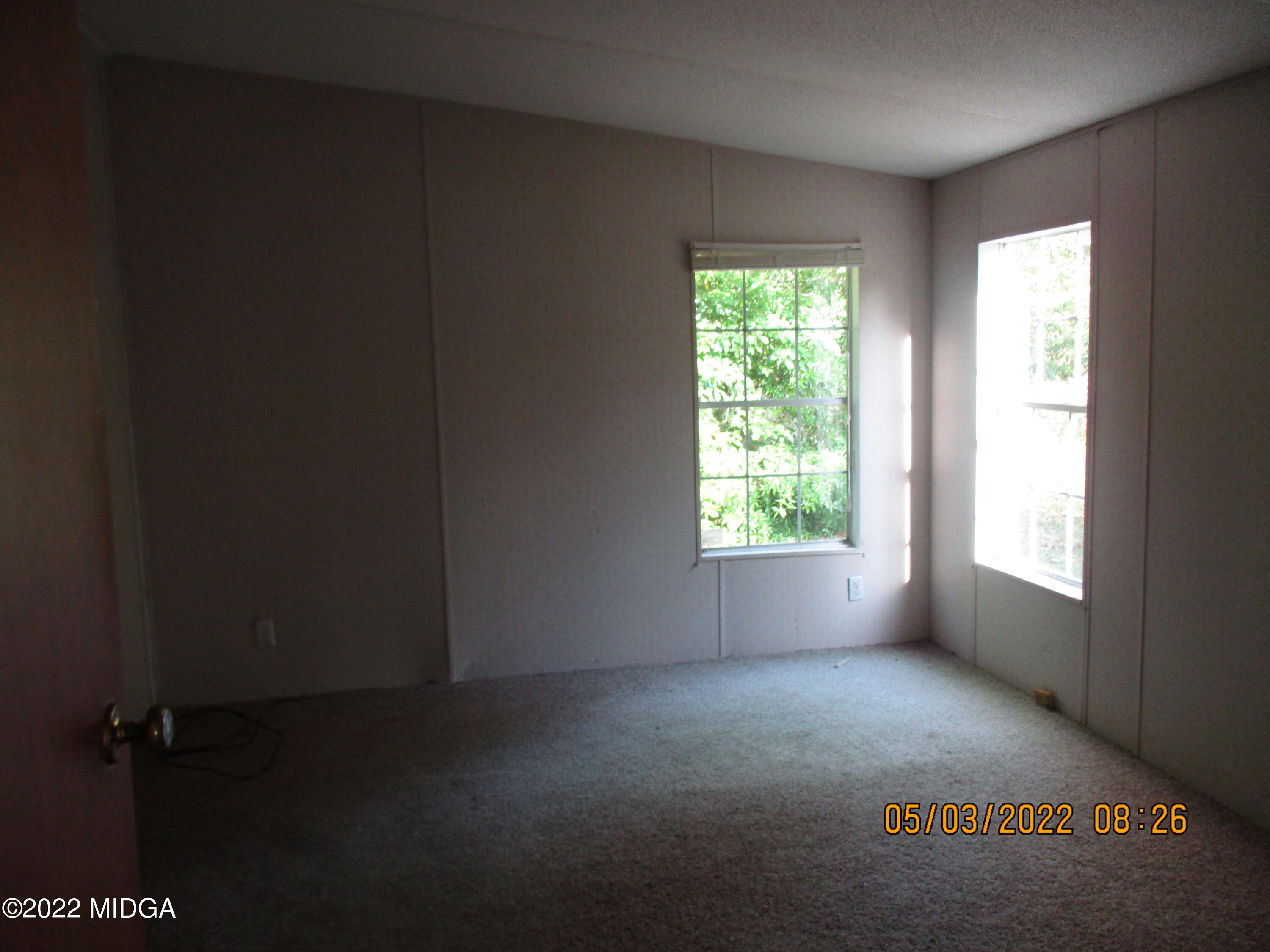 576 Hendrick Road Fort Valley, GA 31030 - Photo 11 of 19 an empty room with windows
