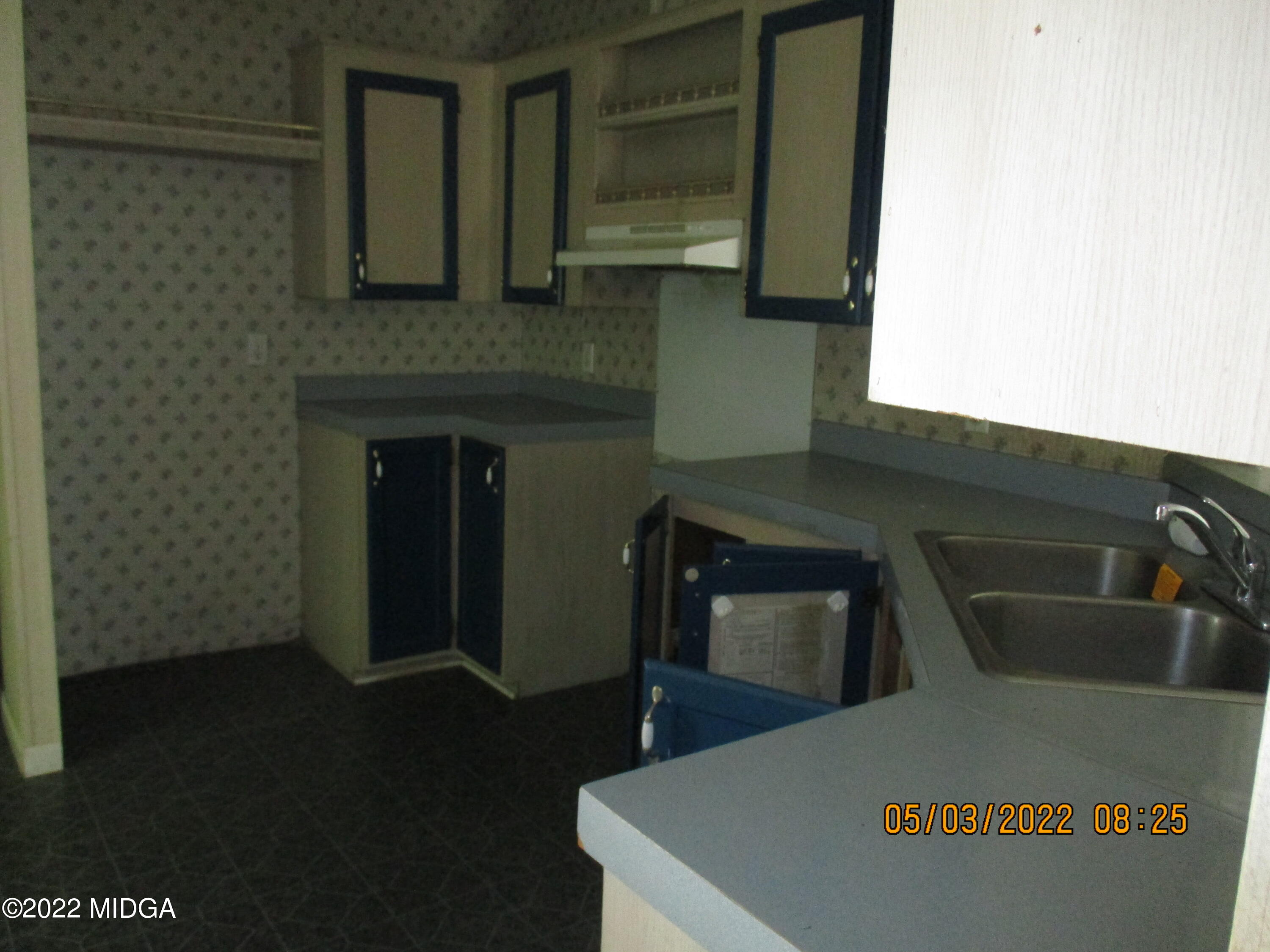 576 Hendrick Road Fort Valley, GA 31030 - Photo 12 of 19 a kitchen with a sink and a refrigerator