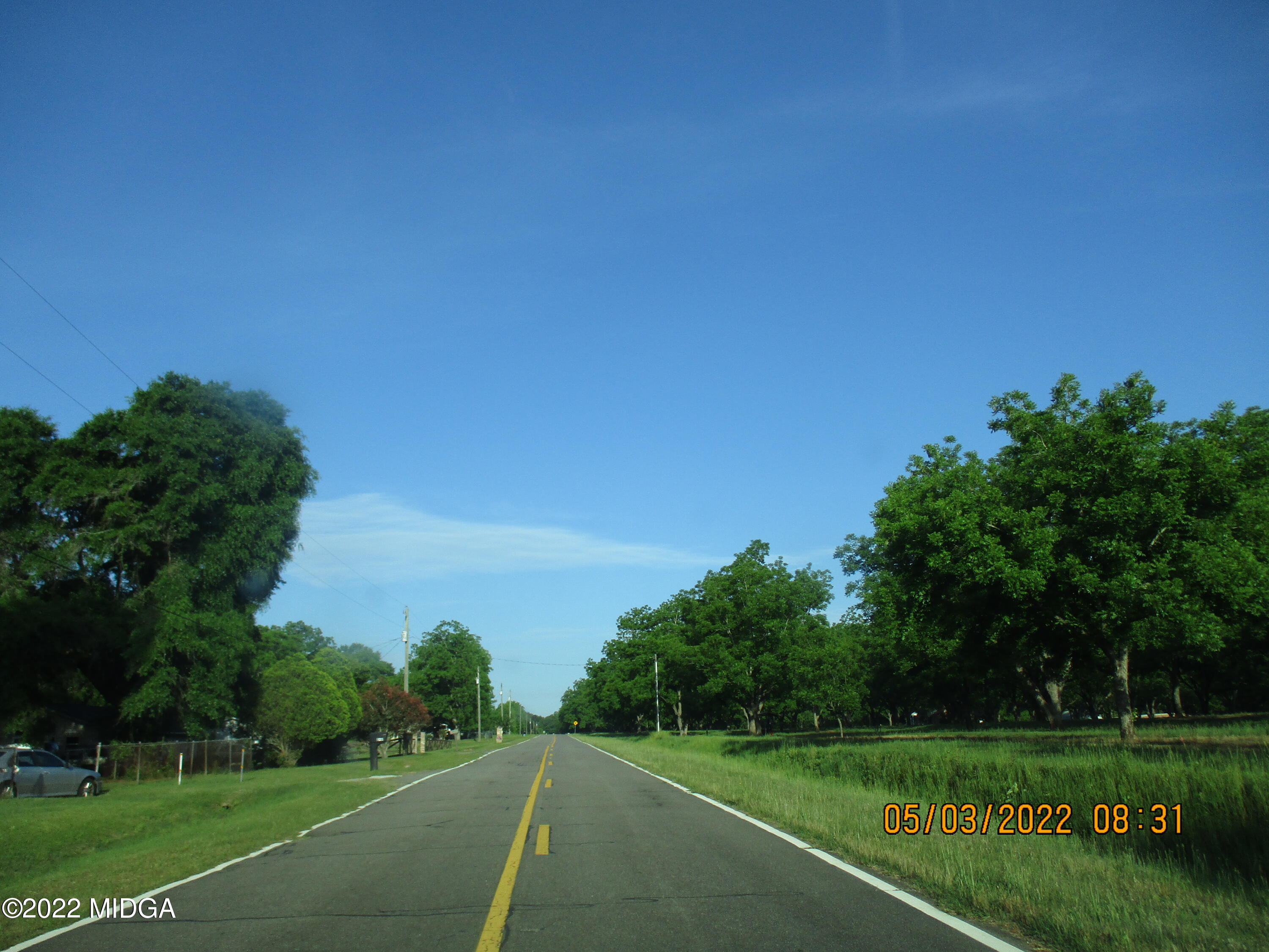 576 Hendrick Road Fort Valley, GA 31030 - Photo 18 of 19 a view of a grassy field with trees