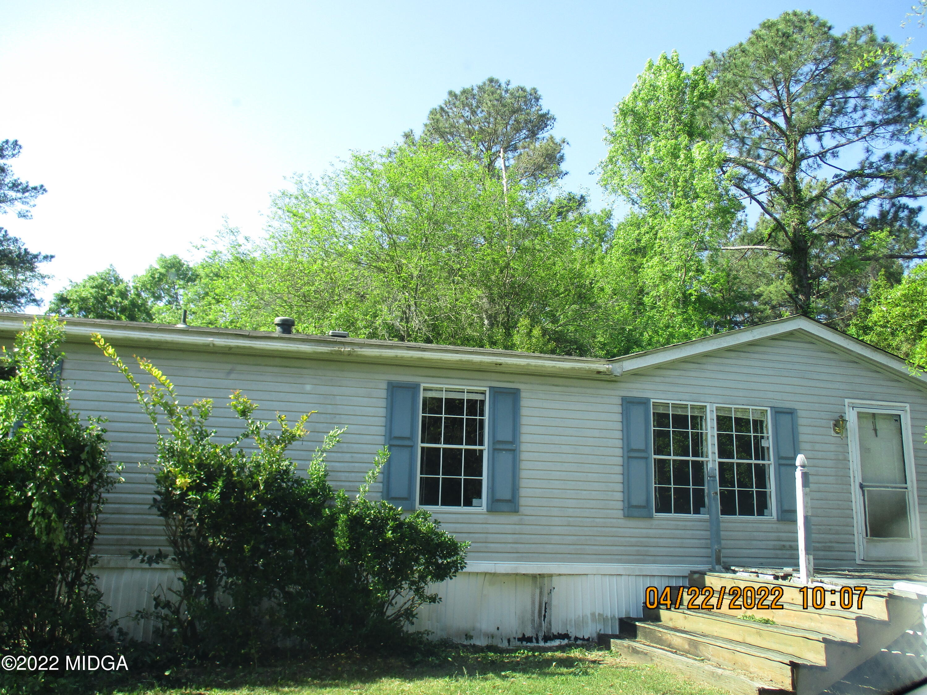 576 Hendrick Road Fort Valley, GA 31030 - Photo 19 of 19 front view of a house with a yard