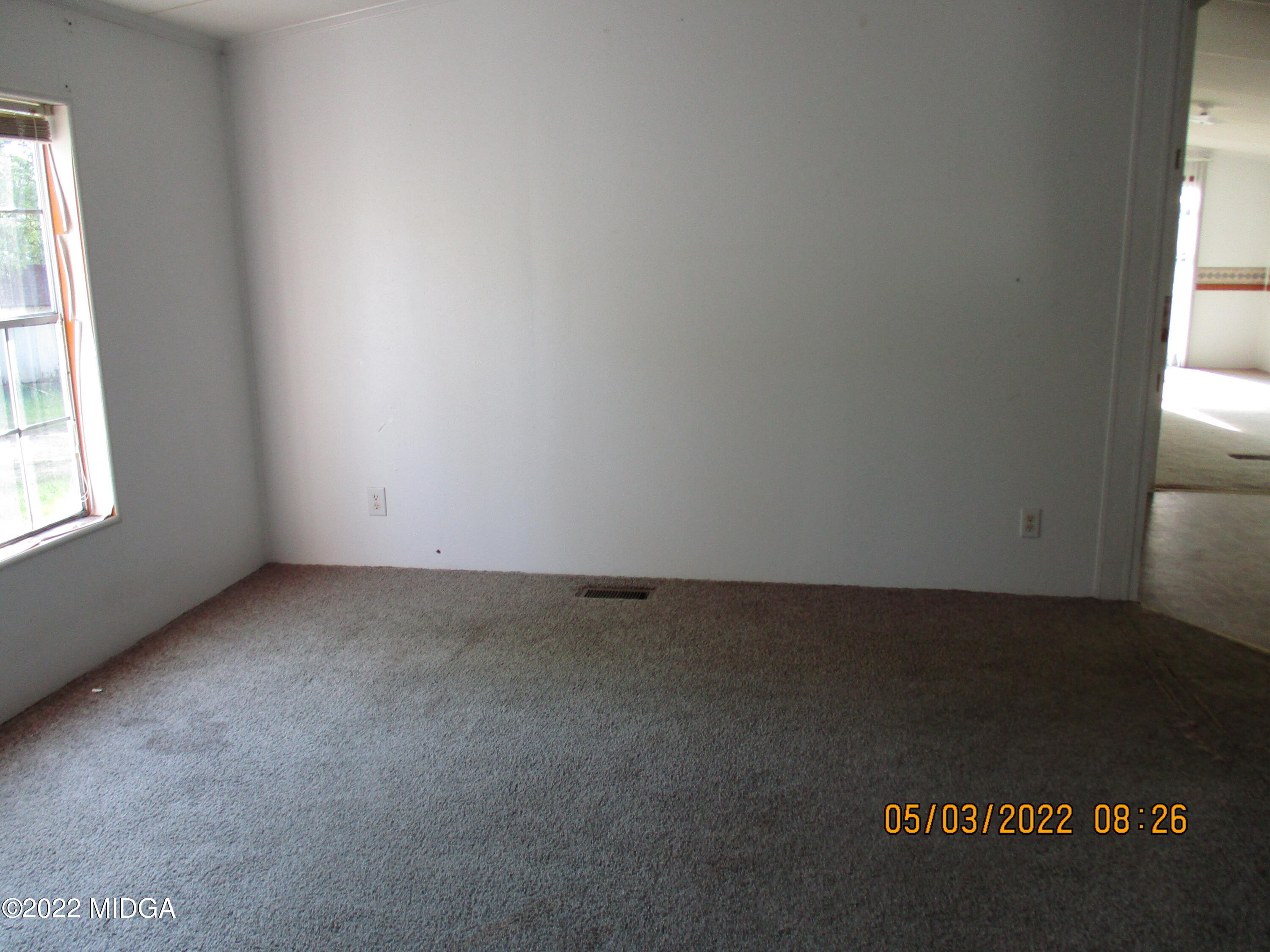 576 Hendrick Road Fort Valley, GA 31030 - Photo 5 of 19 an empty room with a window
