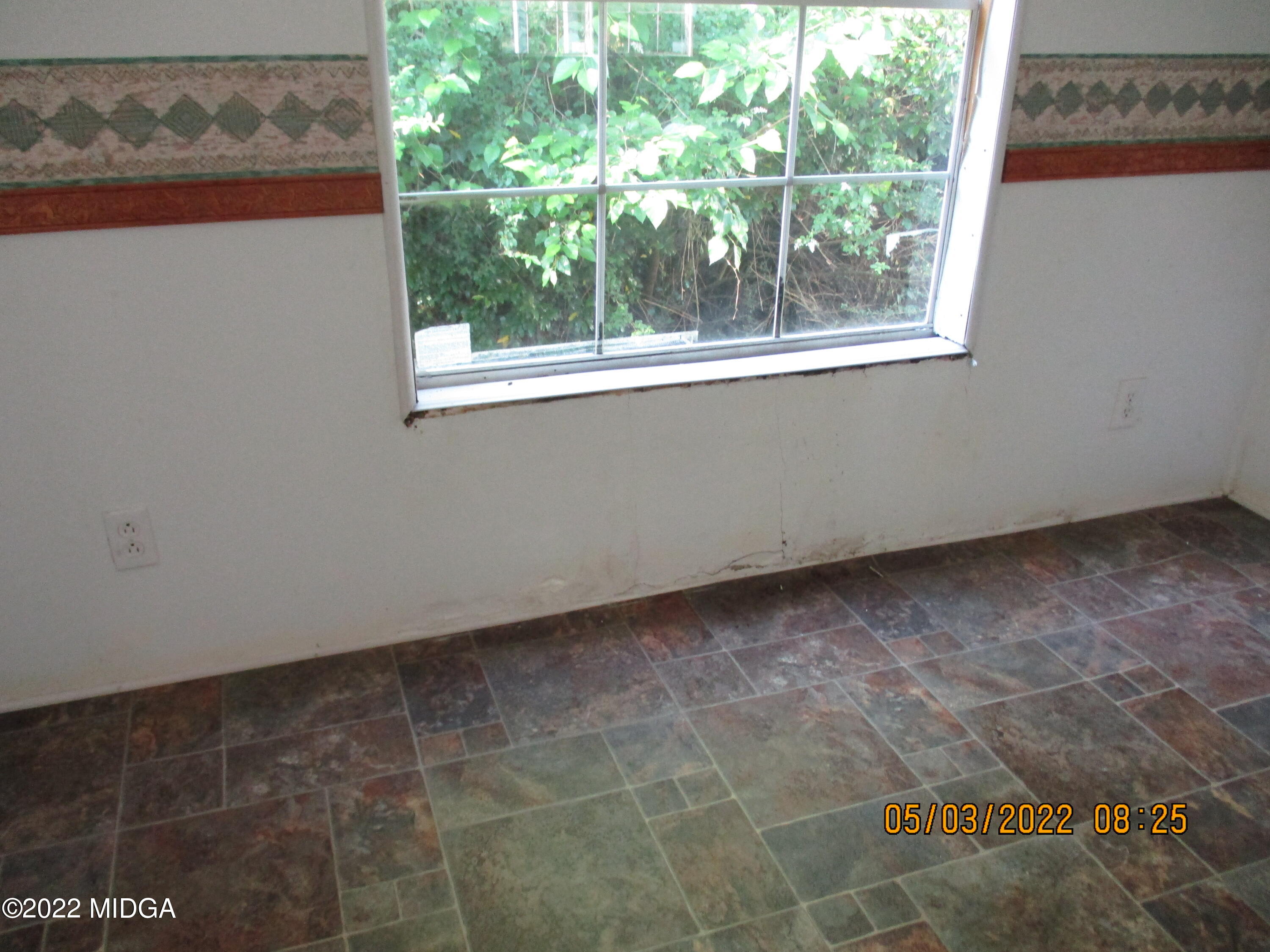 576 Hendrick Road Fort Valley, GA 31030 - Photo 6 of 19 a view of a small space with wooden floor and a window
