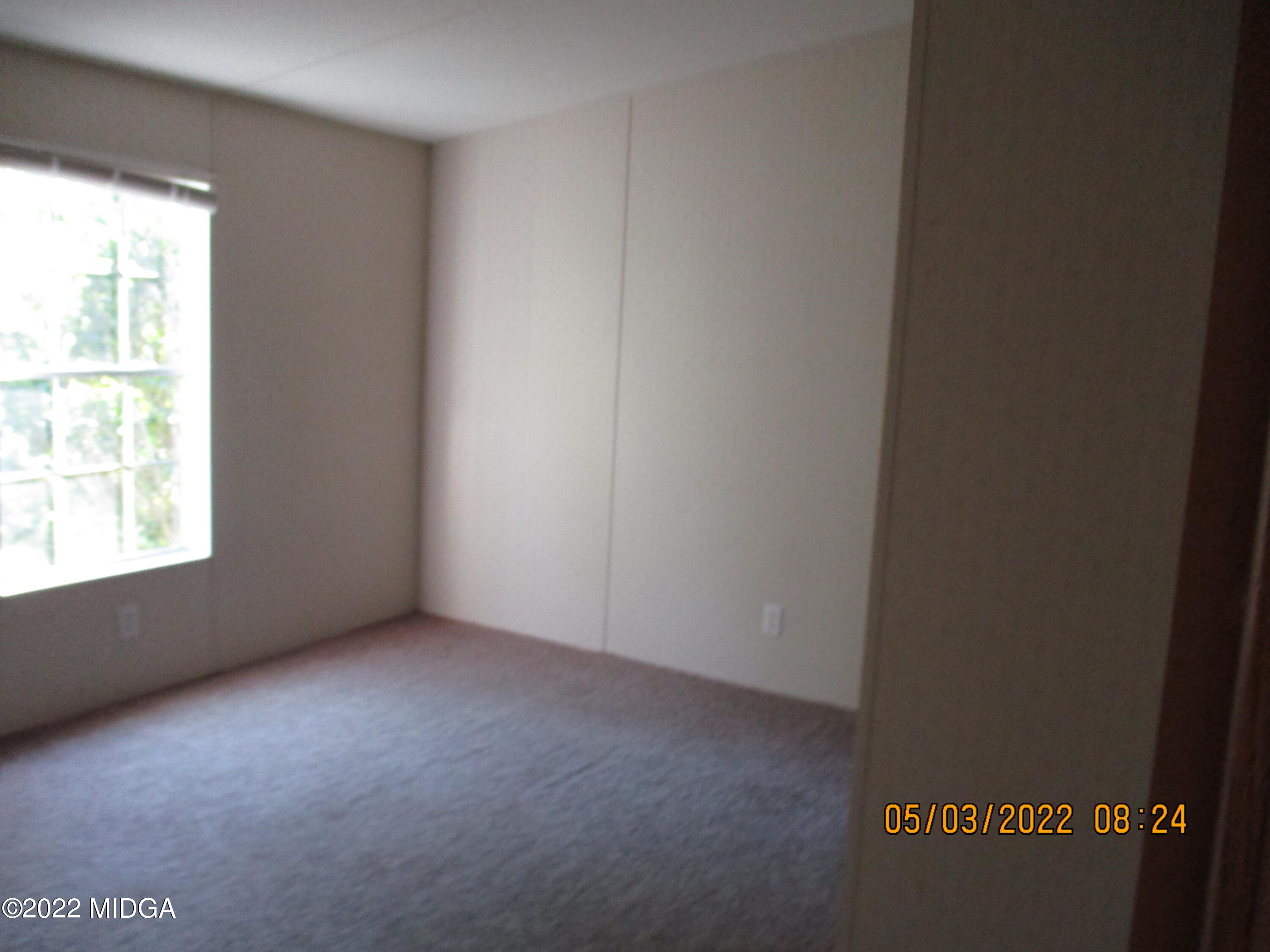 576 Hendrick Road Fort Valley, GA 31030 - Photo 8 of 19 a view of an empty room with a window