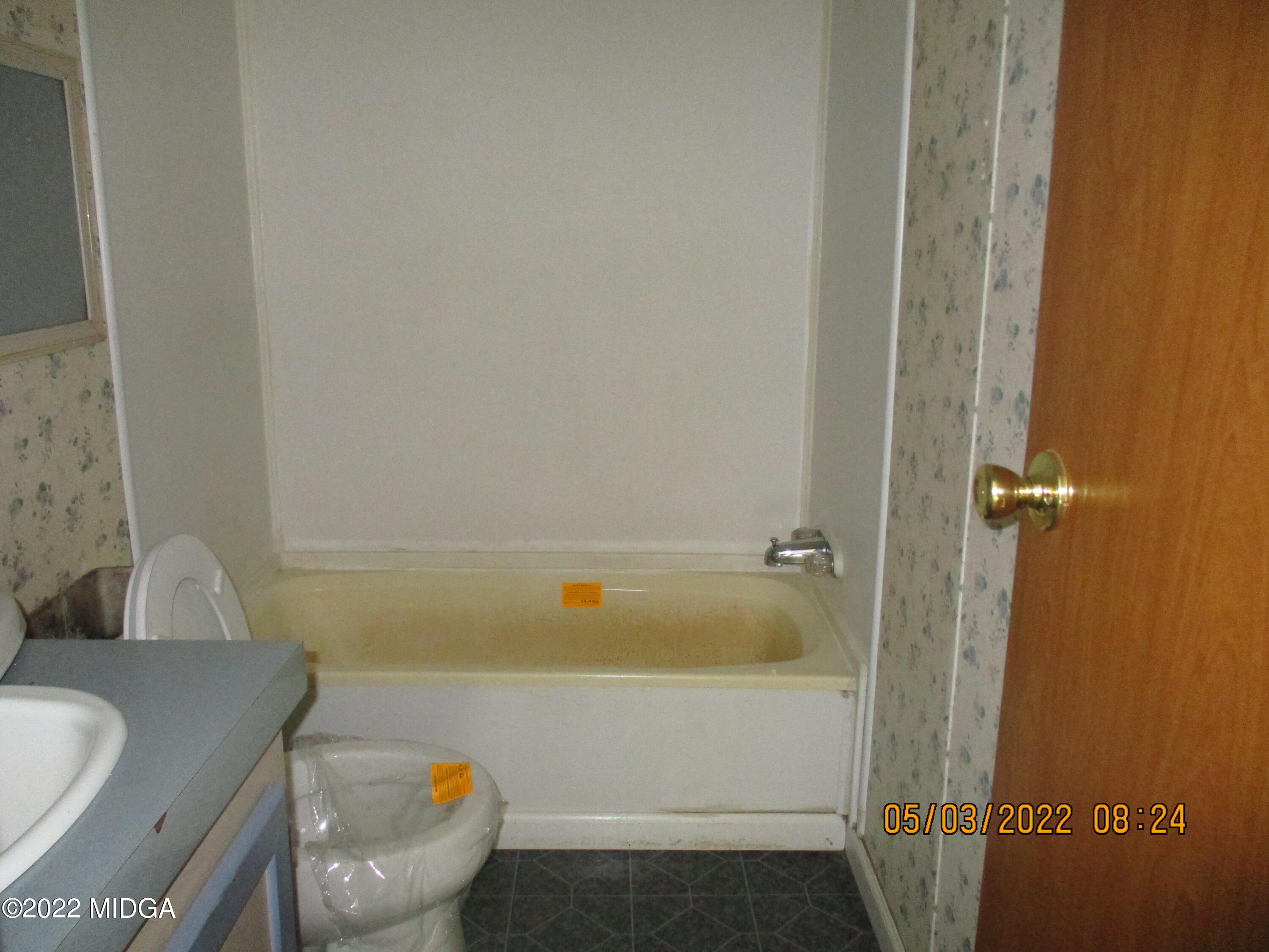 576 Hendrick Road Fort Valley, GA 31030 - Photo 9 of 19 a bathroom with a sink and a toilet