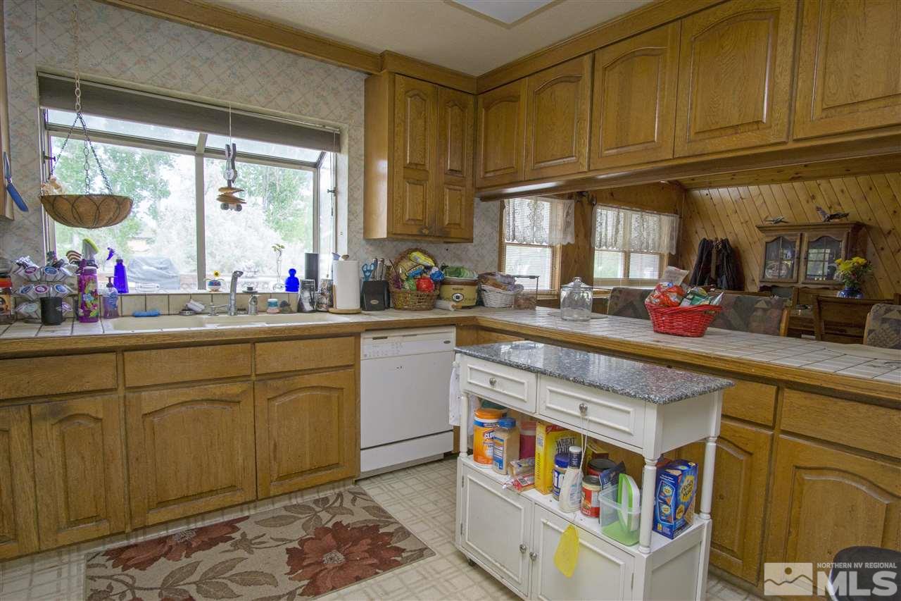 3106 Bottom Road Fallon, NV 89406 - Photo 3 of 16 a kitchen with stainless steel appliances cabinets and a large window