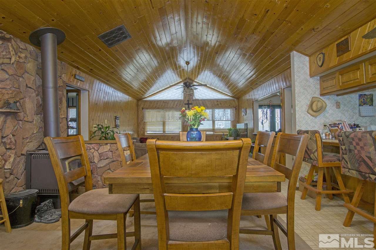 3106 Bottom Road Fallon, NV 89406 - Photo 4 of 16 a view of a dining room with furniture and a chandelier