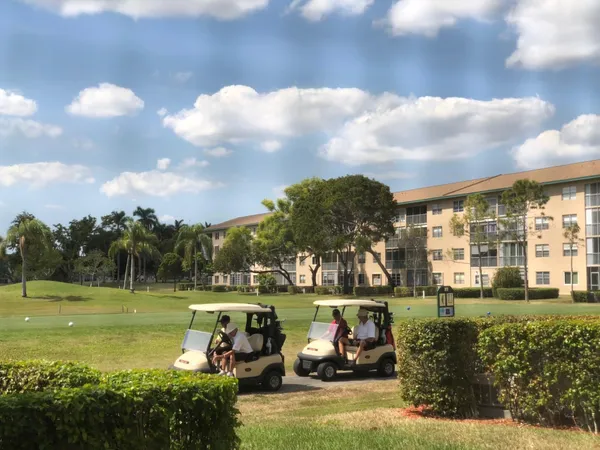a view of a fountain in front of a house