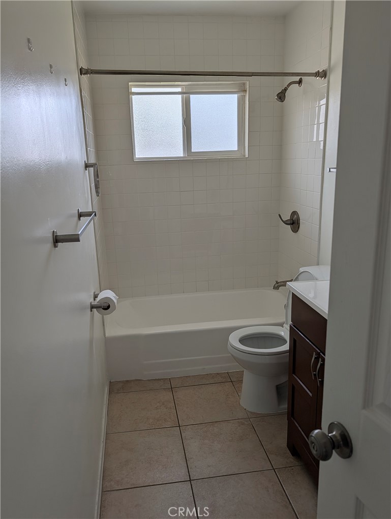 8641 Garfield Street Riverside, CA 92504 - Photo 11 of 19 a bathroom with a toilet a sink and a shower