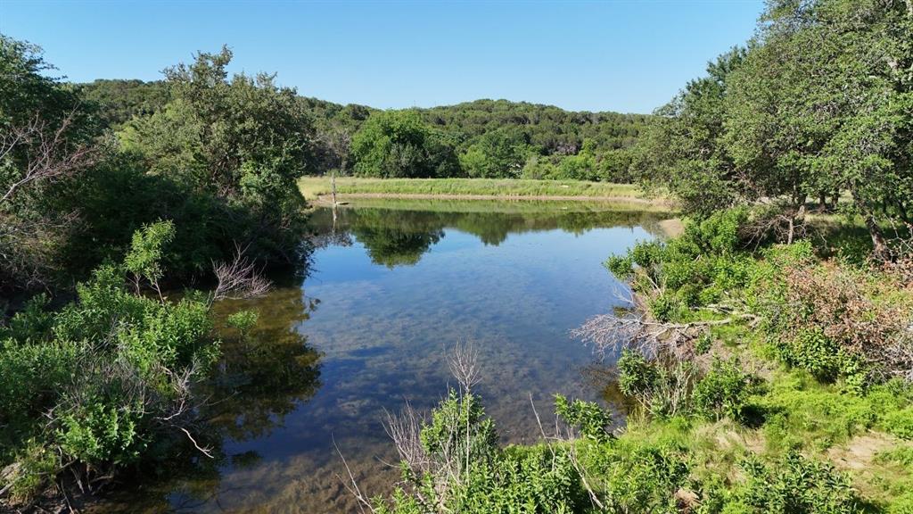 2801 Wind Point Court Tolar, TX 76476 - Photo 13 of 25 a view of a lake with a yard