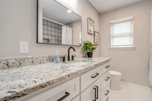 a view of room with furniture and ceiling fan