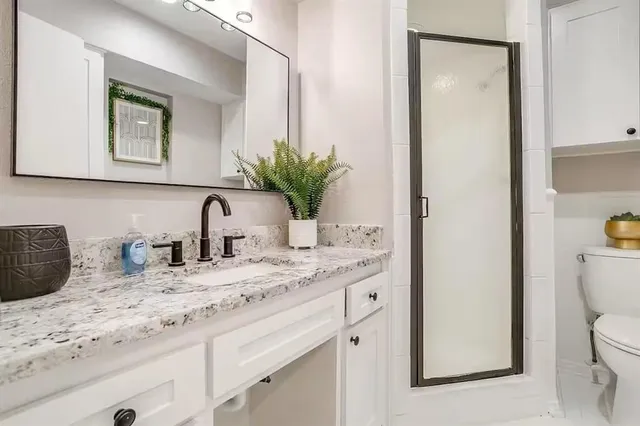 a bedroom with a bed chair and window